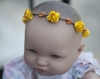 Couronne de fleurs cheveux bébé aux fleurs jaunes