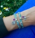 Bracelet ruban liberty au motif fleuri, vert, violet et beige, main et perle violette