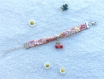 Bracelet ruban liberty au motif fleuri, rose et jaune, breloque cerise