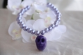 Bracelet perles avec tête de mort violette