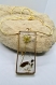 Collier naturel en or fleur de carotte sauvage et feuilles de buis