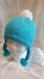 Bonnet pour enfant avec pompom blanc laine acrylique de couleur bleu turquoise t 6/10 ans