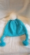 Bonnet pour enfant avec pompom blanc laine acrylique de couleur bleu turquoise t 6/10 ans