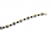 Bracelet perles bicolores jaunes et grises et toupies noires