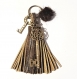 Bijou de sac pompon cuir & métal bronze