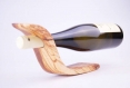 A bottle holder  made with olive wood