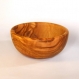 A rustic salad bowl made with olive wood