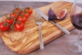A natural cutting board made from olive wood