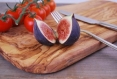A natural cutting board made from olive wood