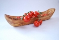 A rustic fruit bowl made with olive wood