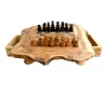 A rustic chessboard with drawer made with olive wood