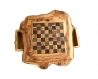 A rustic chessboard with drawer made with olive wood