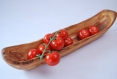 A rustic fruit bowl made with olive wood