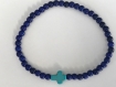 Bracelet perles bleu marine et croix turquoise