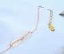 Bracelet femme minimaliste de chaîne  agrémenté d'un duo de cauris - plaqué or