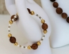 Parure ras-du-cou et bracelet-bois d'olivier-perles nacrées-perles métal bronze-perles métal doré modèle 