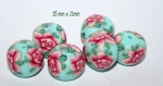 Perles rondelles en polymère fleuri rose sur fond turquoise / la paire