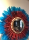 Magnifique miroir en raphia rouge et plumes