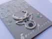 Carte de voeux bonne année en 3d tête de renne paillettes argent étoiles papier blanc texturé neige fond gris 