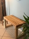 Banc de couloir en bois massif recyclé, un meuble d'entrée en hêtre durable et élégant pour une ambiance chaleureuse.