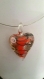 Collier  composé d'un pendentif verre coeur rouge