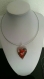 Collier  composé d'un pendentif verre coeur rouge