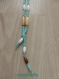 Collier coton vert d'eau en tricotin et perles en bois blanches, beiges et brunes     