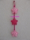 Suspension / mobile étoiles rigolotes en feutrine rose pour chambre de bébé 