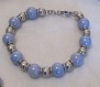 Bracelet fait-main en perles en céramique bleues et grises et en acier 