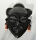 Masque africain en céramique, sérénité . émaillé noir et ocre .18.