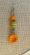 Boucle d'oreille en céramique orange artisanale et perle africaine