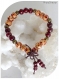 Bracelet élastique en perles de bois marron et orangées avec perles intercalaires couleur bronze.