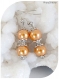 Boucles d'oreilles perles nacrées oranges . crochets argentés.