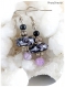Boucles d'oreilles perles de verre noires et violettes .