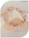 Bracelet perles de verre nacrées saumon . fermoir mousqueton .