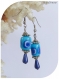 Boucles d'oreilles céramique et perles magiques bleues .