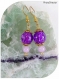 Boucles d'oreilles perles de verre violettes.
