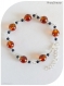 Bracelet perles de verre oranges et noires .