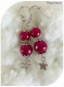 Boucles d'oreilles perles de verre rouges et breloques étoiles .