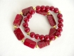 Bracelets élastique perles rouges et or.