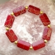Bracelets élastique perles rouges et or.