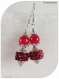 Boucles d'oreilles perles de verre rouges . crochets argentés.