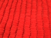 Couverture reversible, plaid, tapis de sol ou autres double pompons - rouge - 100%polyester 