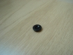 Quatre boutons plastique noir forme ronde   26-72