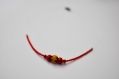 Collier ras du cou perle rouge et jaune sur fil nylon 18cm de diametre