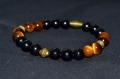 Bracelet h/f. onyx noir/oeil de tigre/perle toupie bronze