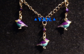Parure inoxydable doré avec oiseaux métal violet turquoise perles bicone cristal violet