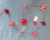 Guirlandes origami motifs g.r.u.e.s tons rouges