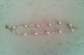 Bracelet en perles de verre nacrées roses et vertes 