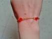 Bracelet en chainette dorée et  perles à facettes orange 